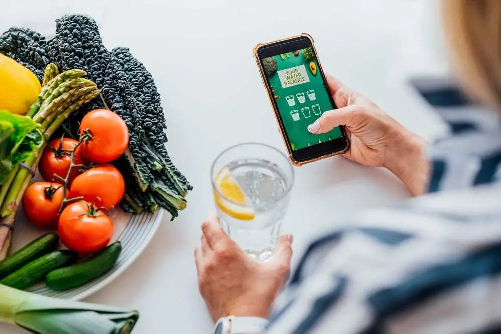 Tracking water intake as part of a consistent daily habit, showing how small actions drive long-term wellness and behavior change