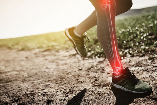 Person jogging on a dirt trail, illustrating how consistent, weight-bearing movement builds bone strength in your 30s.